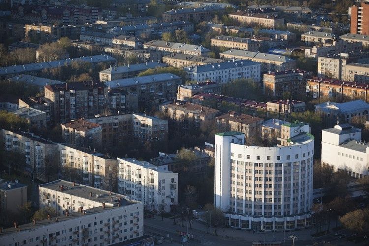 Aerial view of dense Soviet-era apartment blocks and civic buildings
